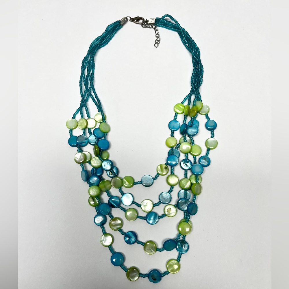 Multi strand necklace with mother of pearl discs